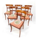 A set of six Regency reproduction mahogany single dining chairs, with floral tapestry seats.