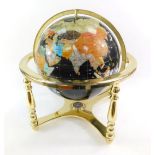 A hard stone set Terrestrial globe, in a brass gimbel frame, 33cm diameter.