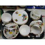 A Pall Mall ware porcelain part tea service, printed with fruit, comprising cream jug, sugar bowl,