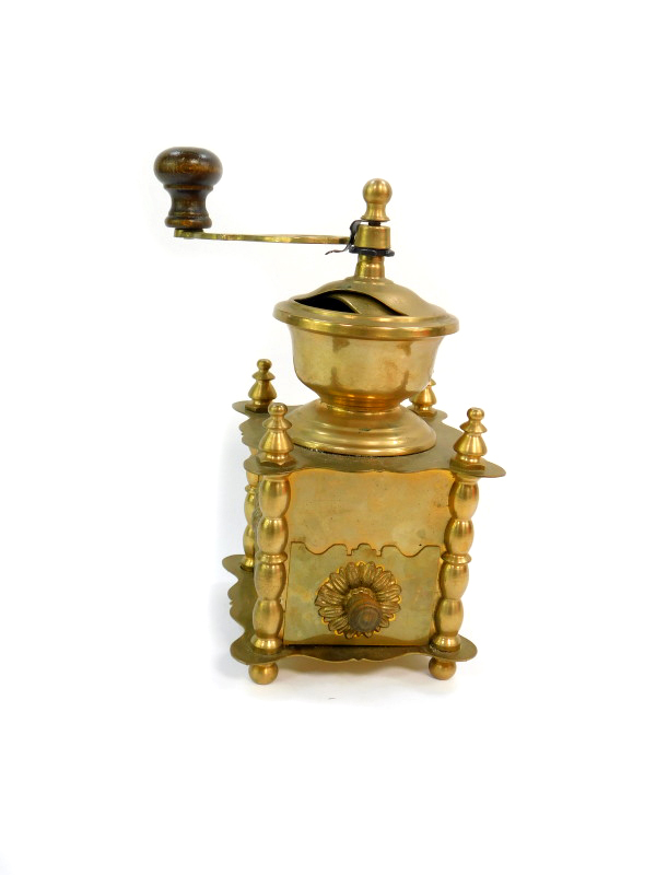 A Continental brass coffee grinder, 13cm wide.