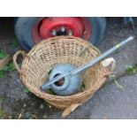 A wicker basket, together with a galvanised watering can. (2)