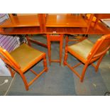 A teak drop leaf table, 74cm high, 148cm wide, 86cm deep., together with four Art Deco style chairs.