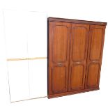 A white two door wardrobe, mahogany effect wardrobe, and a fire guard. (3)