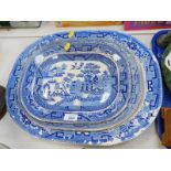 Three 19thC blue and white graduated meat platters, decorated in the Willow pattern. (AF)