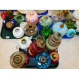 A Continental majolica oil lamp base, further pottery and parian oil lamp bases, and assorted