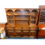 An Old Charm Sovereign oak dresser, the top with an arrangement of shelves, and a pair of glazed