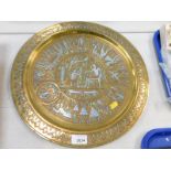 An Egyptian Damascene brass tray, decorated with Pharaohs, pyramids and Egyptian Gods, 40cm
