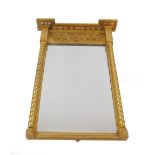 A Regency gilt pier glass, of rectangular form with ball ornamentation to the top and a frieze of