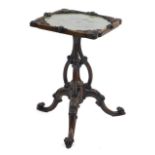 A Victorian rosewood occasional table, with embroidered snap top, on an elaborate stem terminating