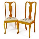 A pair of Queen Anne style dining chairs, each with shaped cresting rails, hourglass splats and