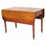An early 19thC Pembroke table, the oblong top raised above a frieze drawer on ring turned