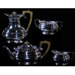 An Elizabeth II silver four piece service, comprising coffee pot 21cm high, teapot, milk jug and two