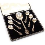 A George V silver spoon set, by Viners, comprising serving spoon 24cm high, and six shaped spoons,