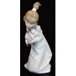 A Lladro figure of a girl holding kitten, no. 5712, printed and impressed marks beneath, 19cm high.