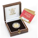 A Britannia 1/10oz proof gold coin, in case and box with paperwork.