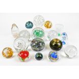 Various glass paperweights, to include floral type 11cm diameter, swirl pattern, etc. (a quantity)