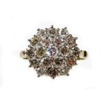 A diamond nineteen stone cluster ring, with three layers of round brilliant cut diamonds, each in