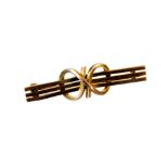 A bar brooch, set with three horizontal lines, with entwined centre section and plain pin back