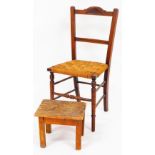 An Edwardian walnut occasional chair, with rush seat and turned front legs, 88cm high, and a small