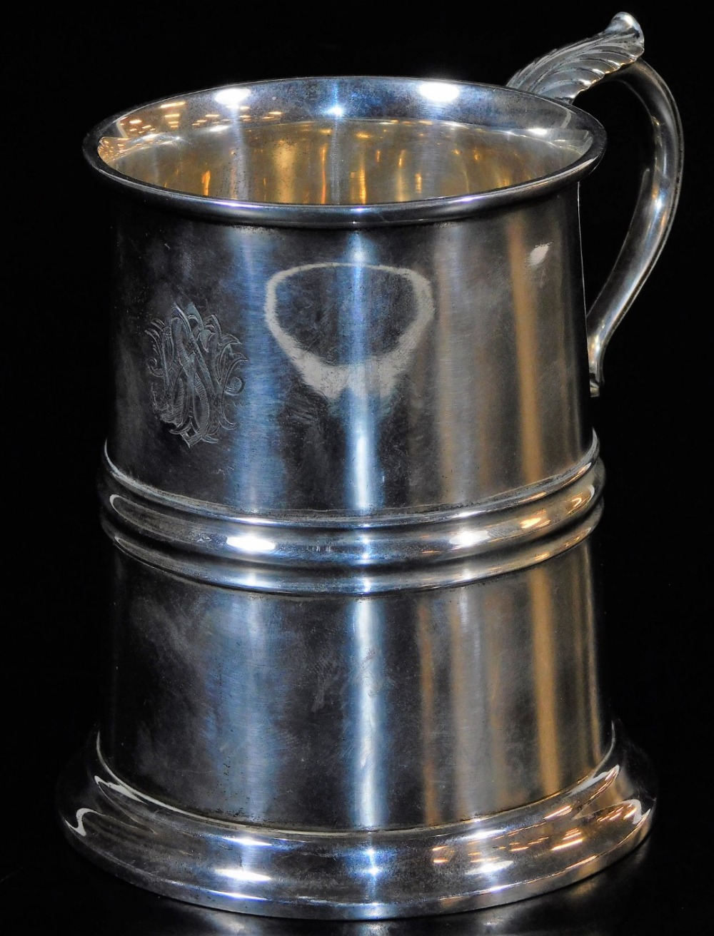 A George V silver mug, with cylindrical body, acanthus capped ear handle, circular foot, London