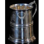 A George V silver mug, with cylindrical body, acanthus capped ear handle, circular foot, London