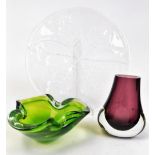 A Kosta Boda glass leaf plate by Ann Warff, of shaped form, 32cm wide, a amethyst and clear glass