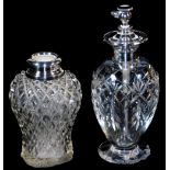 A 20thC cut glass perfume atomiser, with sterling top, 17cm high and a hobnail cut vase with