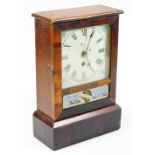 An early 20thC Cottage No. 2 walnut and pine cased timepiece, the decorative glazed front