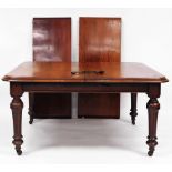 A Victorian mahogany extending wind out dining table, the moulded oblong top raised on heavy