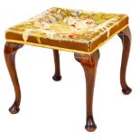 A late 19thC mahogany framed stool, the over stuffed top in petit point floral pattern, on