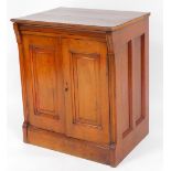 An early 20thC mahogany cupboard, of rectangular form with two panelled doors raised on a block base