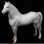 A Beswick figure of a Welsh pony, in white and grey colour way, printed marks beneath, 17cm high.