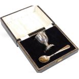 An Elizabeth II silver two piece Christening set, comprising egg cup, 6cm high, and spoon,