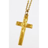 A cross pendant, marked 9ct, 3cm high, attached to a slender link necklace marked 375, 3.2g all in.