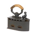 A 19thC box charcoal iron, of large proportion, with wooden handle and hinged centre with cockerel