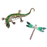 An Art Deco style lizard brooch, set with green glass sections to the back, with plain pin fastener,