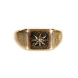 A 9ct gold signet ring, with star emblem centred by small white stone, size S, 4.1g all in.