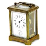 An early 20thC brass carriage clock, of rectangular form with 6cm back plate, set with a Roman