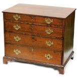 An 18thC oak chest, of four long graduated drawers, each with plate back swan neck handles, on
