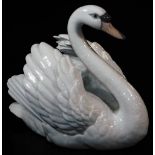 A 20thC Lladro figure of a swan, printed marks beneath, 18cm high.