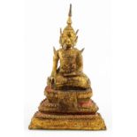 A late 19thC/early 20thC Thai Rattanakosin bronze Buddha, on a seated figure, on stepped base