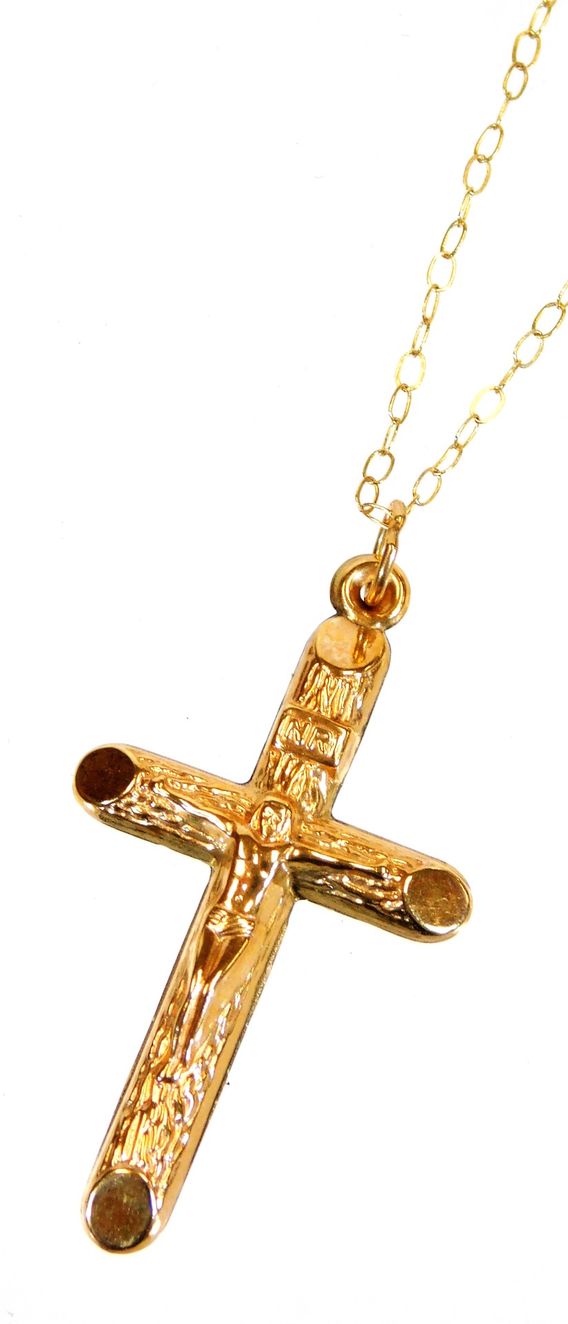 A slender necklace, marked 9ct, attached to a marked cross pendant, 3cm high.