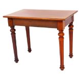 A late 19thC mahogany side table, the rectangular top raised on reeded cylindrical turned legs, 66cm