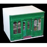 A 20th model tavern bar, with articulated front painted green, the white body with open section