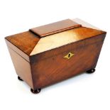 An early 19thC mahogany tea caddy, of sarcophagus form, with part fitted interior on compressed