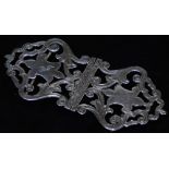 A George V silver two piece buckle, of shaped pierced form with scrolls and central cartouche,