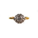 An 18ct gold dress ring, florally set with small diamonds, size M-N, 2.5g all in.