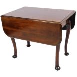 A Victorian mahogany drop leaf table, raised on heavy baluster legs, terminating in club feet,