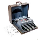 A vintage 20thC Imperial Good Companion No.5 portable typewriter, in grey, with grey and green keys,