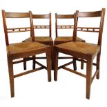 A set of four 19thC oak, elm and rush seated dining chairs, with horizontal orb splats, drop in